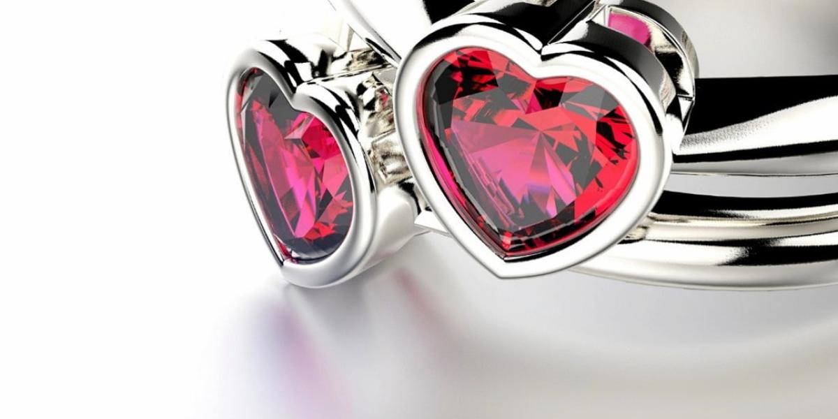white gold rings with red heart-shaped ruby
