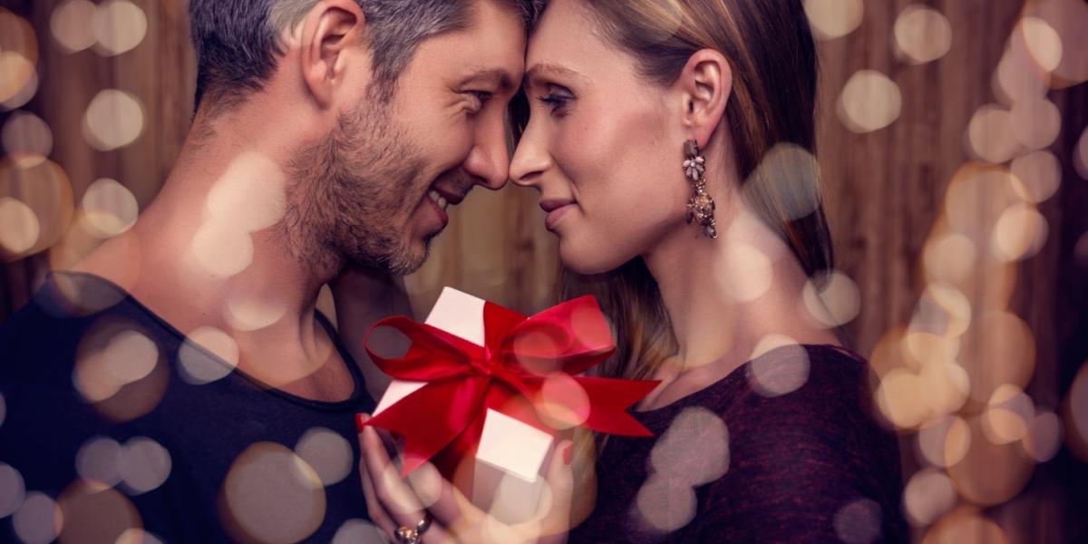 Couple enjoying a gift giving moment